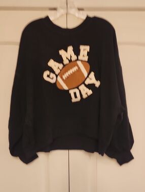 Judith March Black Top with Gold Logo